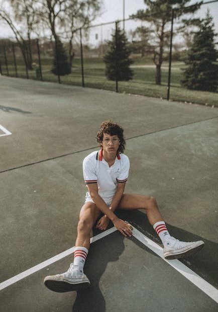 Man Sitting on the Ground of a Court 