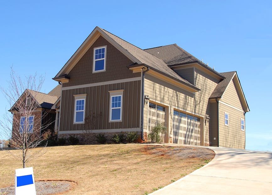 Brown and Beige Wooden House Under Blue Sky