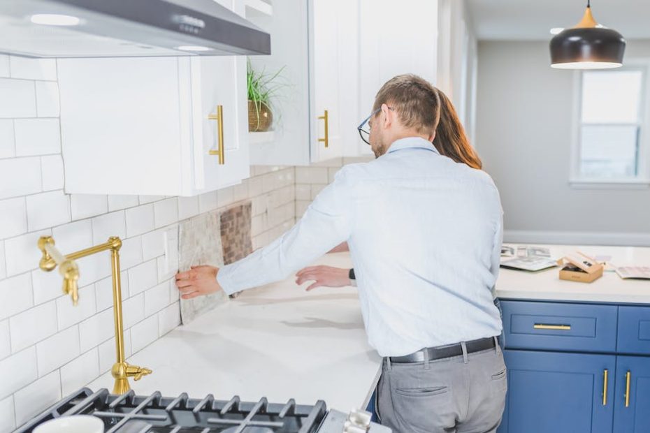 Real Estate Agents Checking the Tiles in the Kitchen